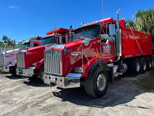 Red commercial dump trucks
